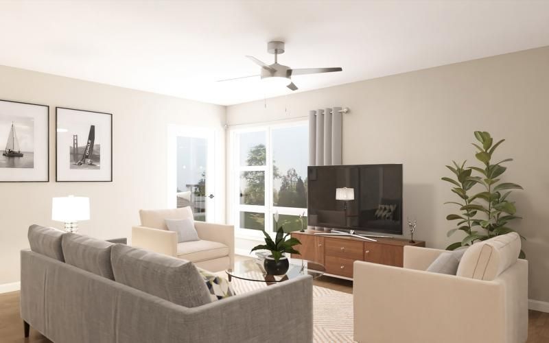 a living room with a tv and couches