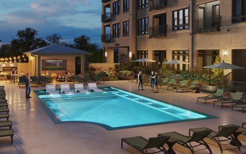 a pool with people walking around it