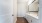 bathroom with large mirror sinks and toilet