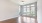 living room with wood flooring and windows