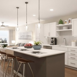 a kitchen with a large island and bar stools