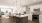 a kitchen with white cabinets