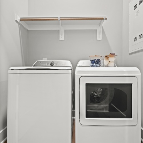 a laundry space with a washer and a dryer