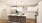 a kitchen with white cabinets