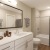 a bathroom with a tub sink and toilet